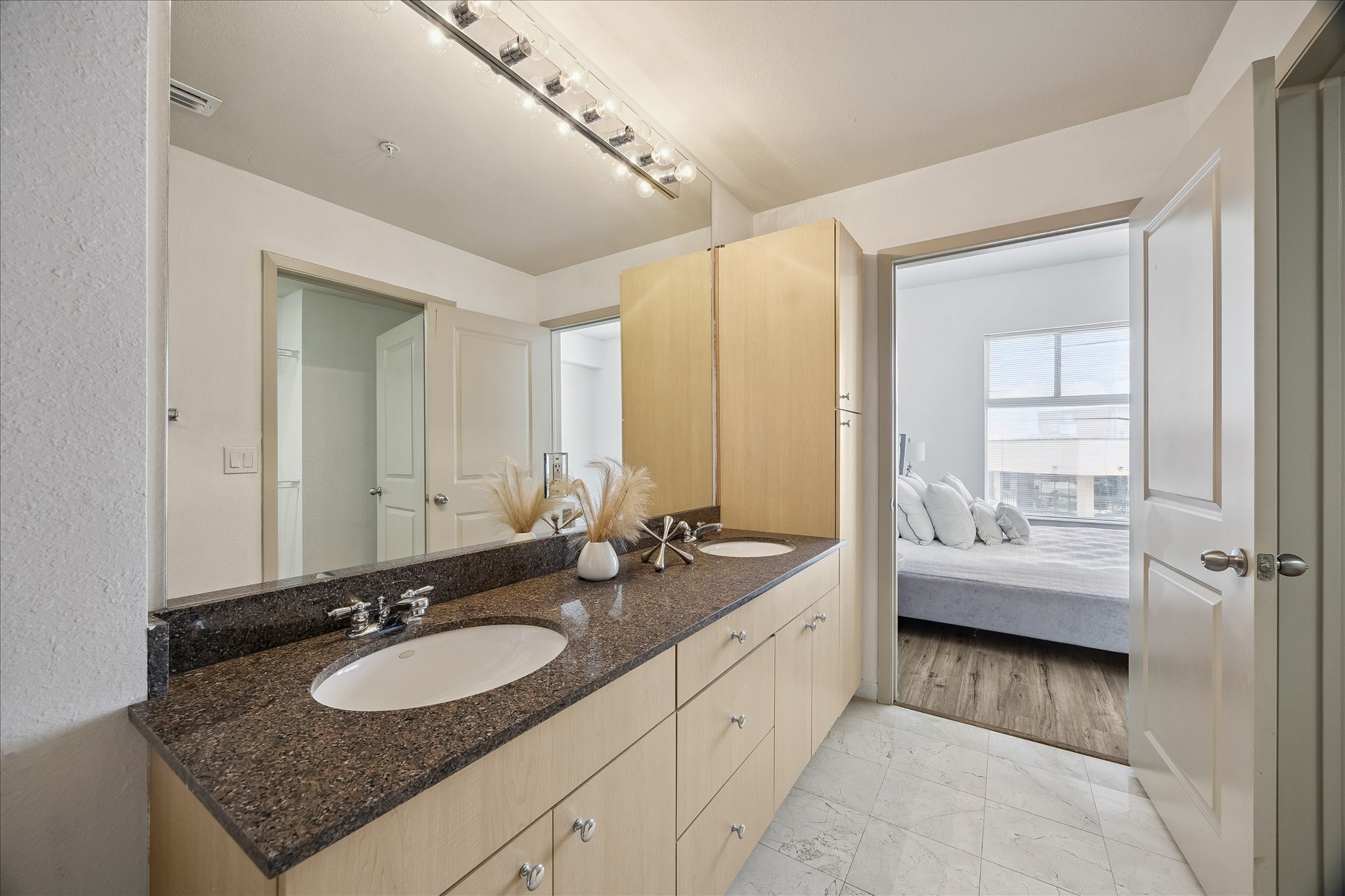 3505 Sage Road, Unit 2810 Houston, TX 77056 - Photo 12 of 26 a bathroom with a sink double vanity and a bathtub