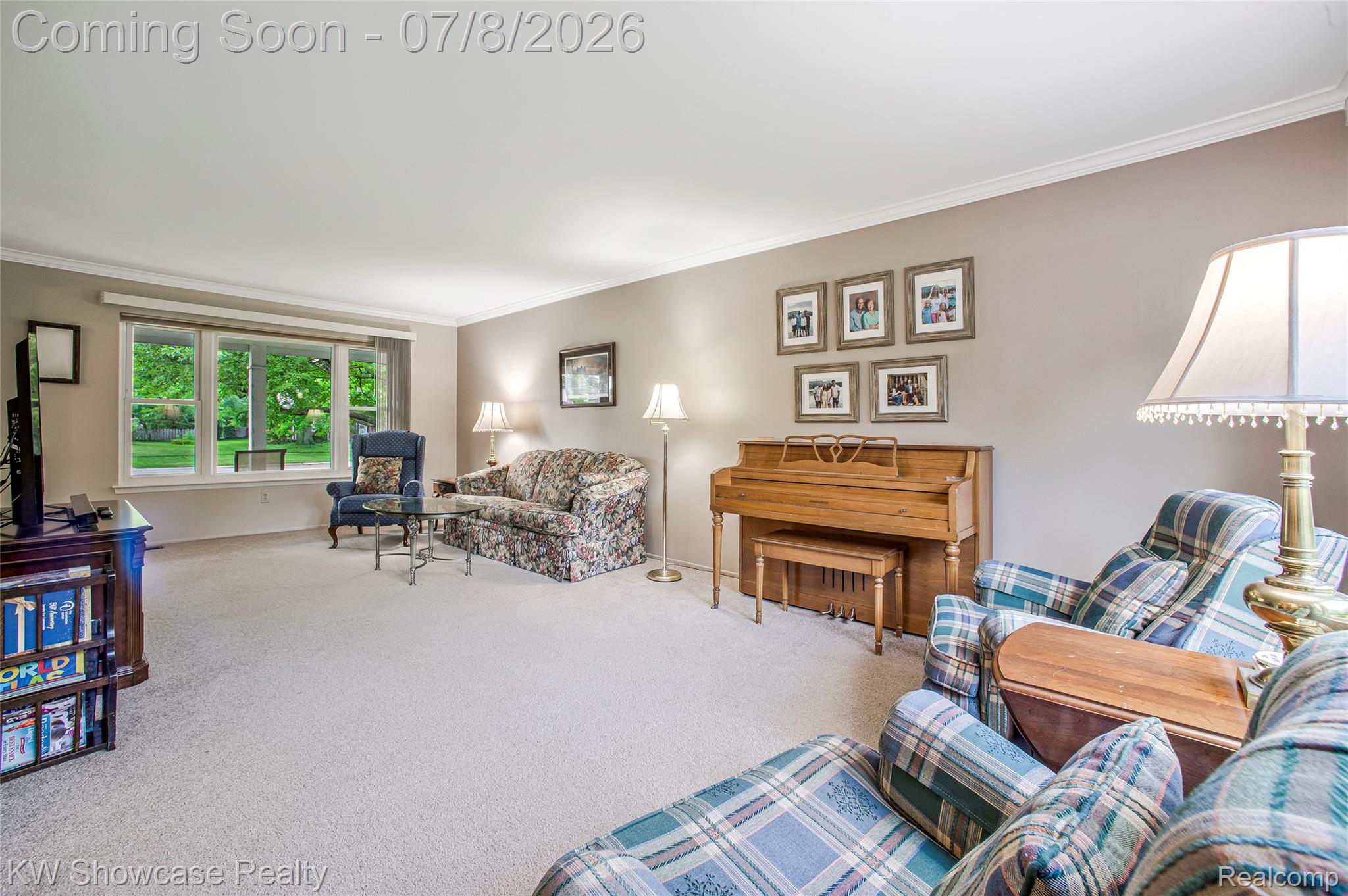 16720 Wayne Road Livonia, MI 48154 - Photo 9 of 29 Spacious room featuring neutral carpeting, a large picture window, and crown molding