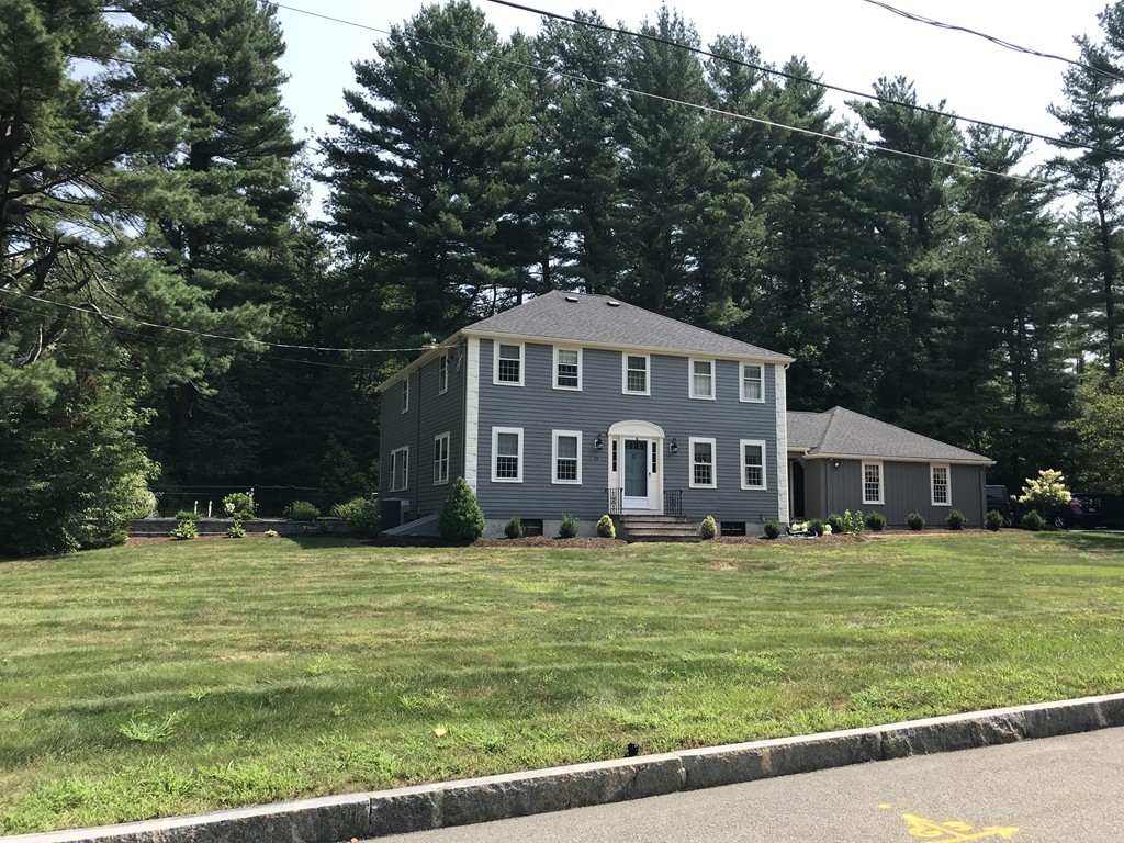 a view of a house with a big yard