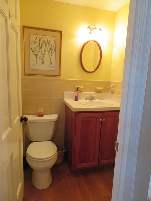 43 Mayflower Circle Hanover, MA 02339 - Photo 17 of 24 a bathroom with a toilet sink vanity and mirror