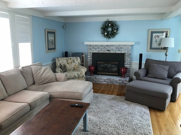 43 Mayflower Circle Hanover, MA 02339 - Photo 2 of 24 a living room with furniture and a fireplace