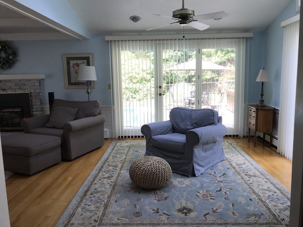 43 Mayflower Circle Hanover, MA 02339 - Photo 5 of 24 a living room with furniture and a fireplace