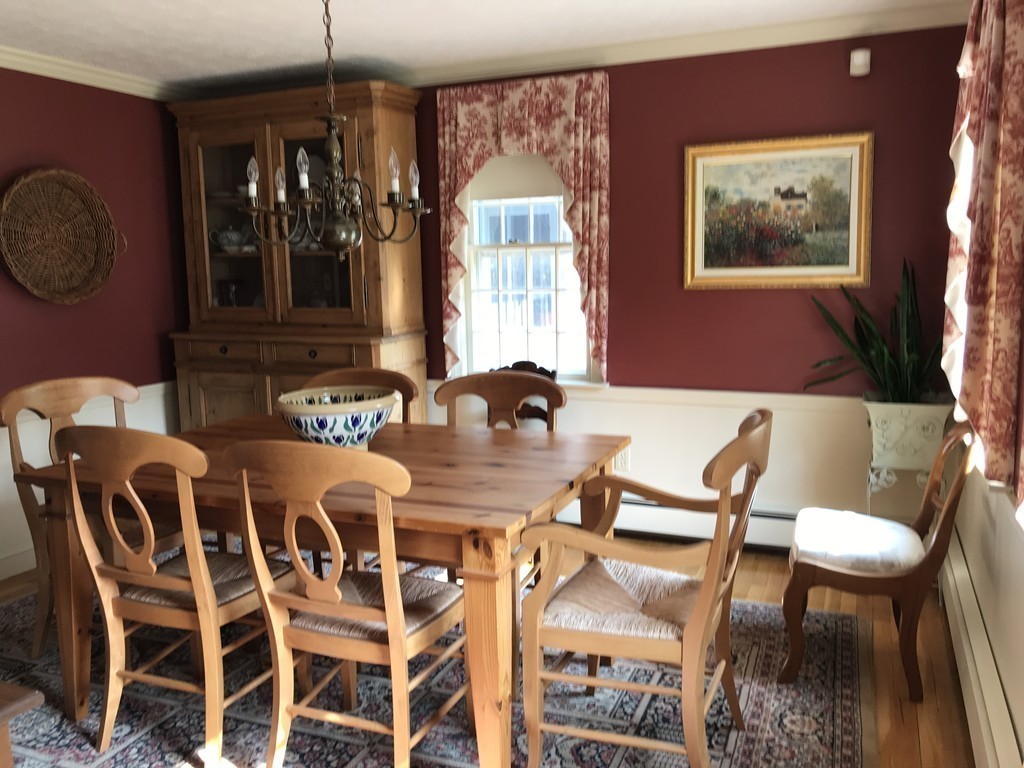 43 Mayflower Circle Hanover, MA 02339 - Photo 7 of 24 a view of a dining room with furniture and chandelier