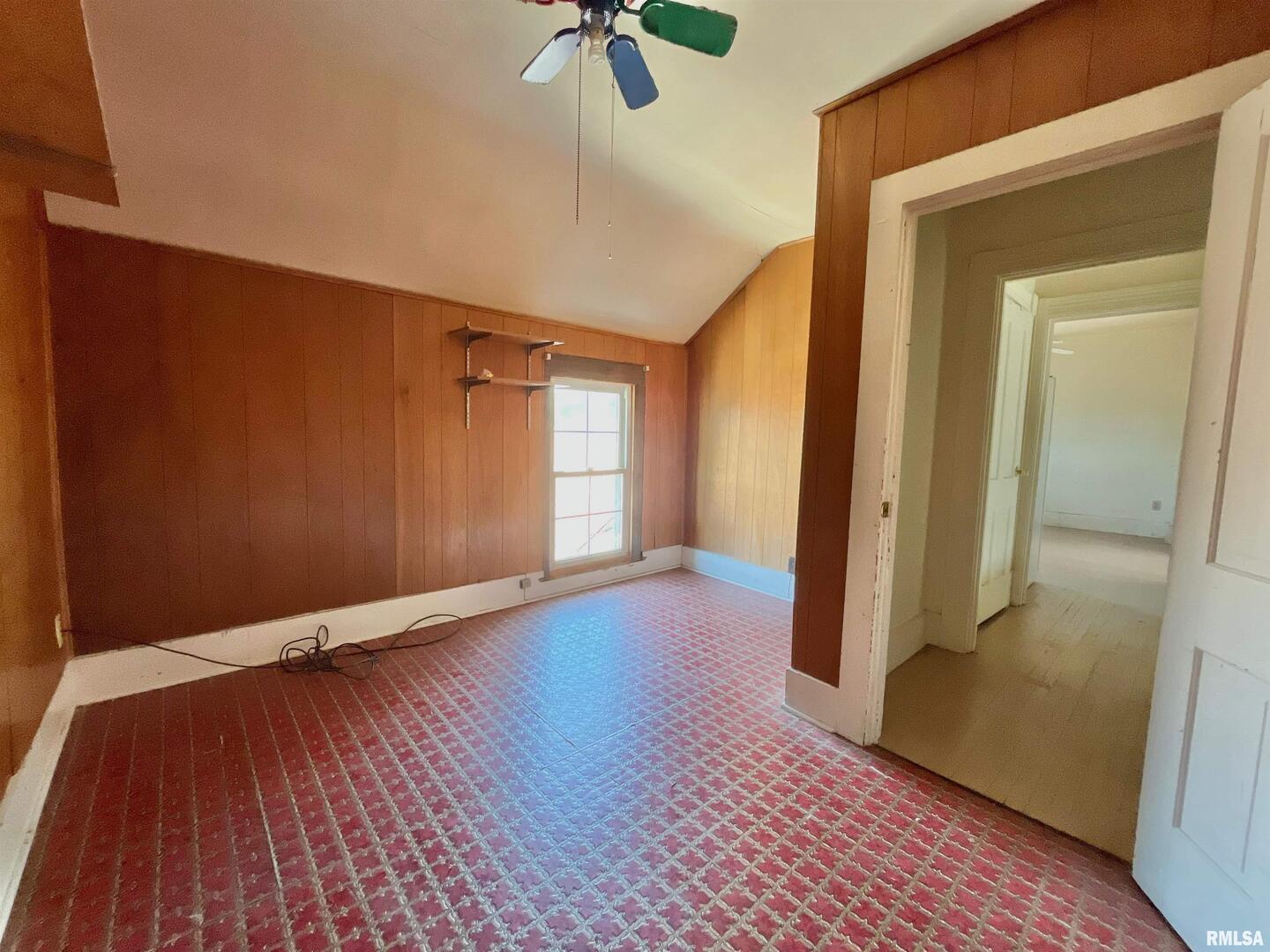 633 4th Avenue South Clinton, IA 52732 - Photo 27 of 34 a view of an empty room with a window and wooden floor