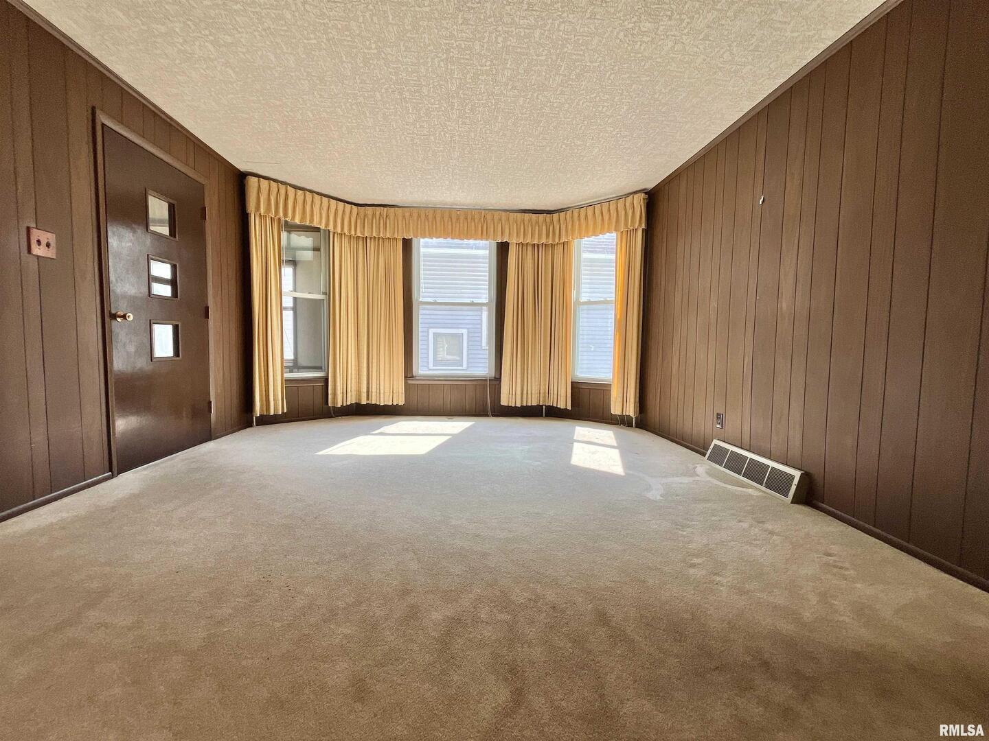 633 4th Avenue South Clinton, IA 52732 - Photo 6 of 34 a view of a livingroom with a staircase