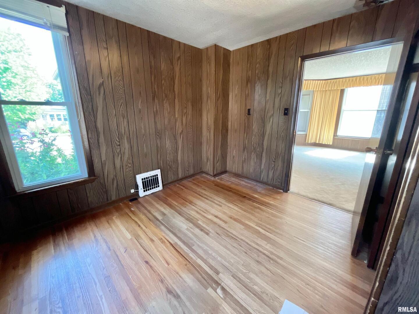 633 4th Avenue South Clinton, IA 52732 - Photo 7 of 34 a view of a room with wooden floor and stairs