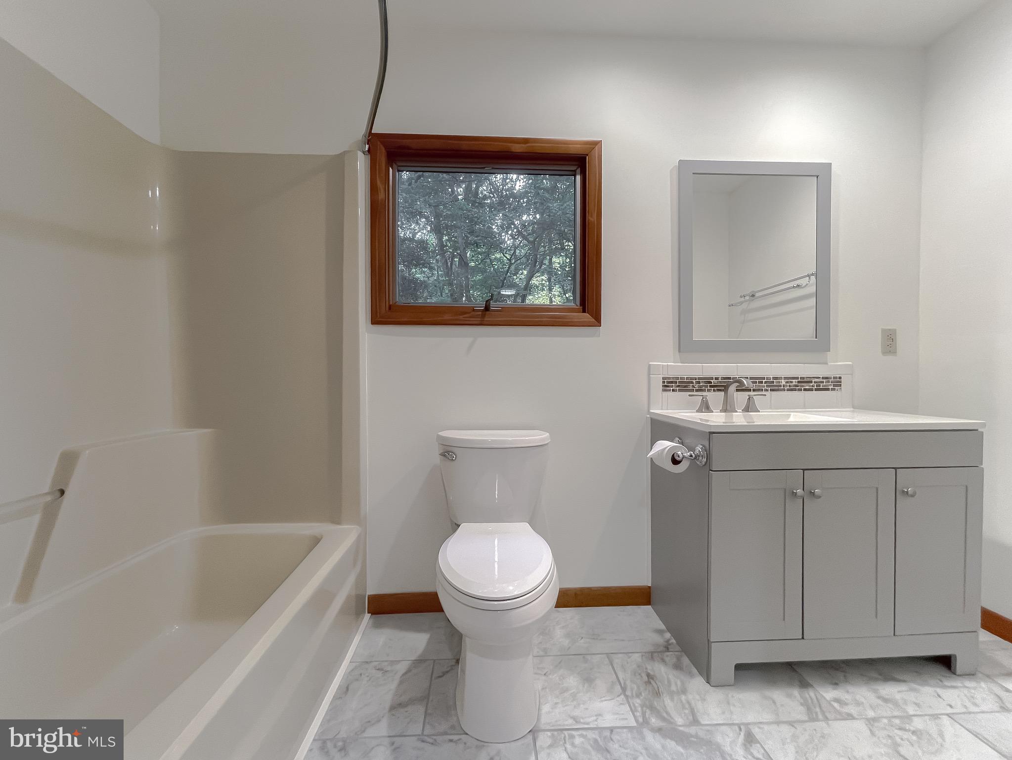 14814 Point Lookout Road St. Inigoes, MD 20684 - Photo 25 of 59 Primary bathroom New flooring, vanity, toilet