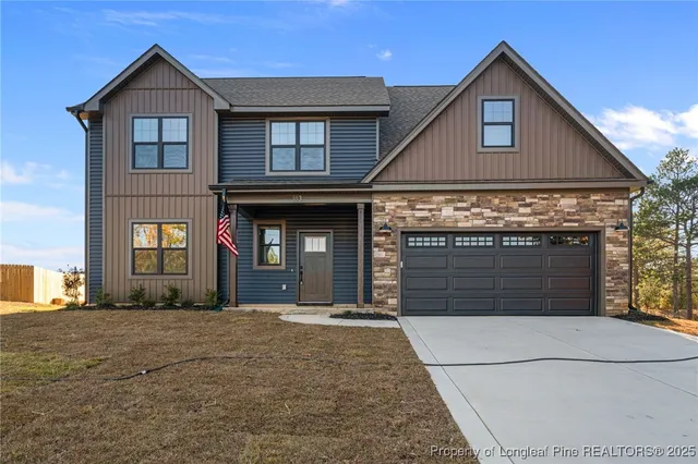 a front view of a house with yard