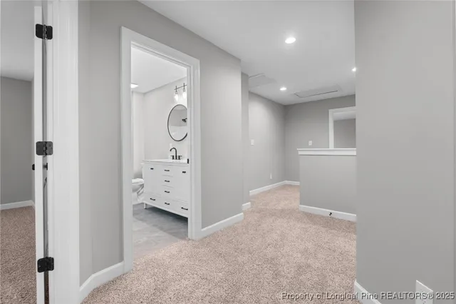 a view of a hallway with white walls