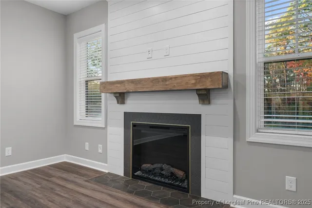 a room with a fireplace and a window