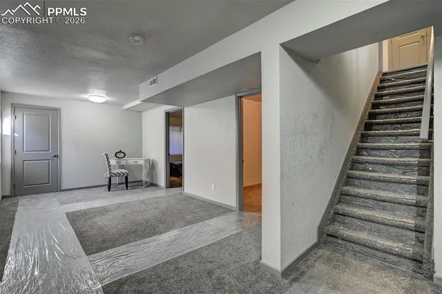 a view of a hallway with staircase