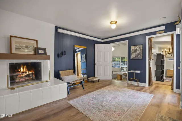 a bathroom with a granite countertop sink a toilet a mirror and vanity