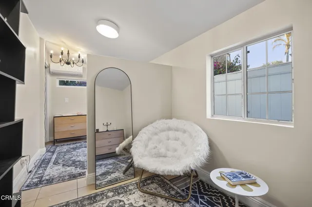 a living room with furniture and window