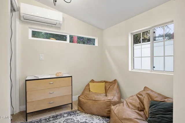 a living room with furniture and a rug