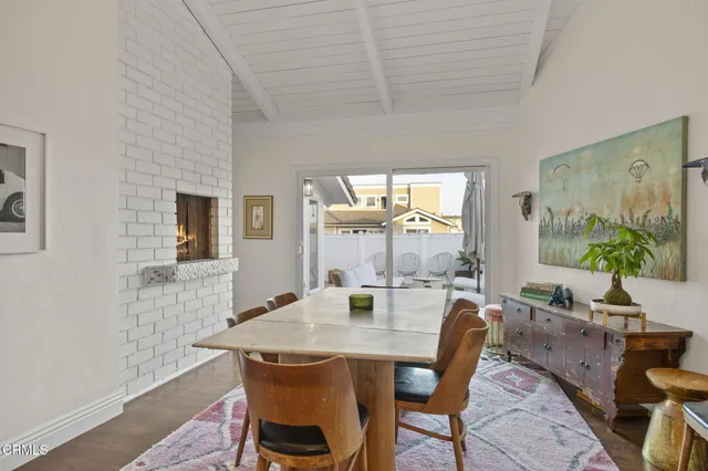 a kitchen with kitchen island granite countertop a stove and a sink