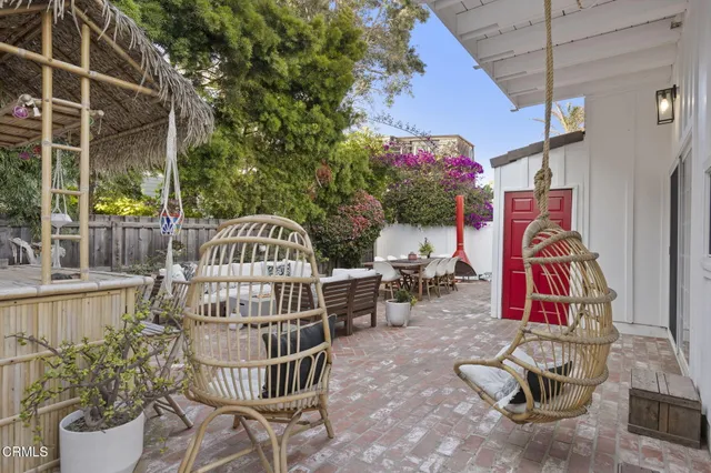 a outdoor space with patio couch and a fire pit