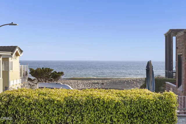 a view of a patio with a table and chairs