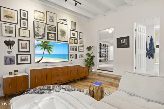 a bedroom with bed and a large window