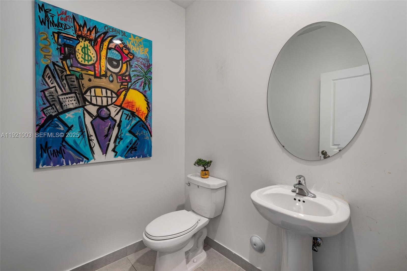 21189 Southwest 127th Court Miami, FL 33177 - Photo 15 of 46 a bathroom with a sink mirror and toilet