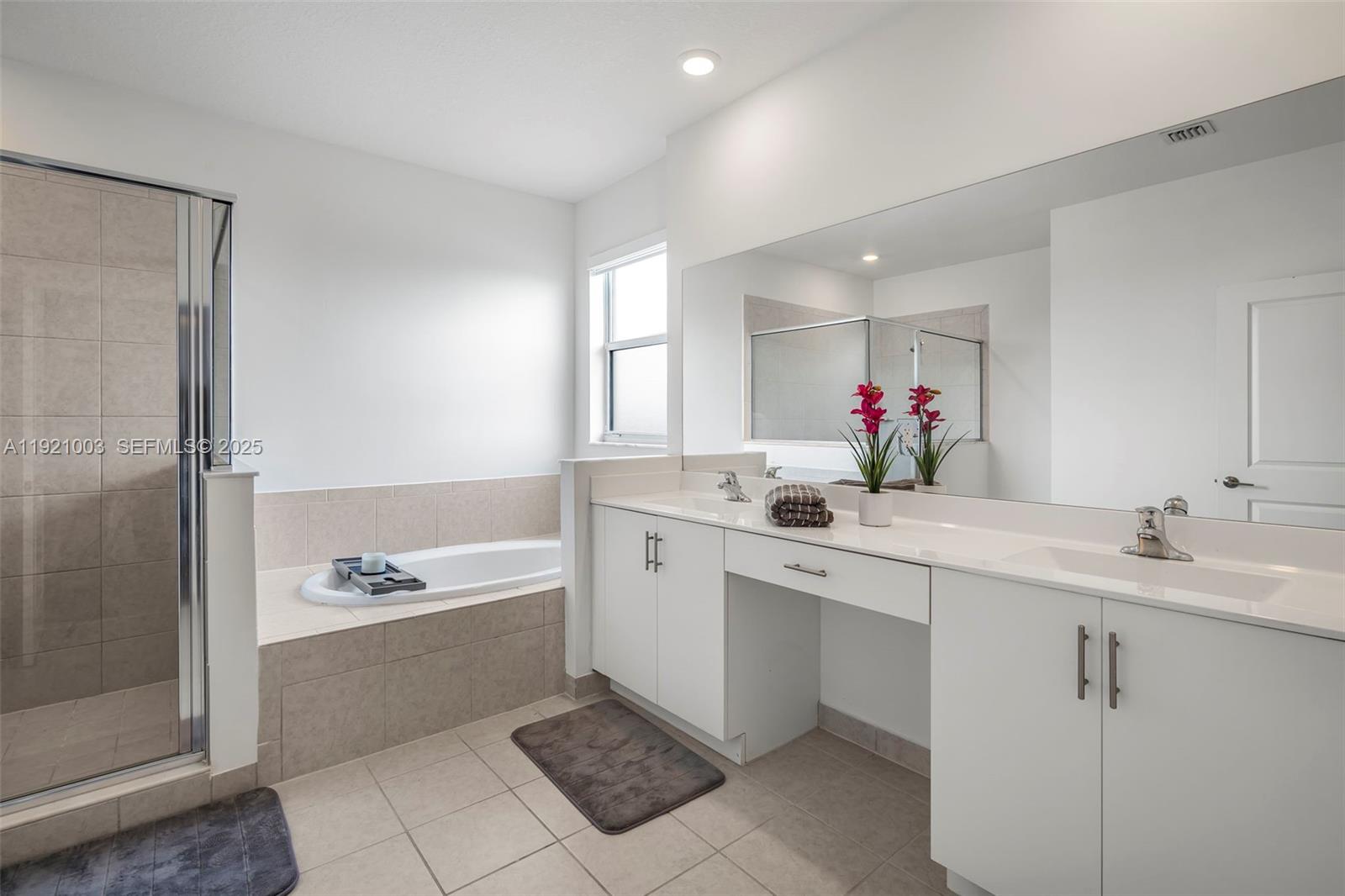 21189 Southwest 127th Court Miami, FL 33177 - Photo 24 of 46 a spacious bathroom with a bathtub shower sink mirror and toilet