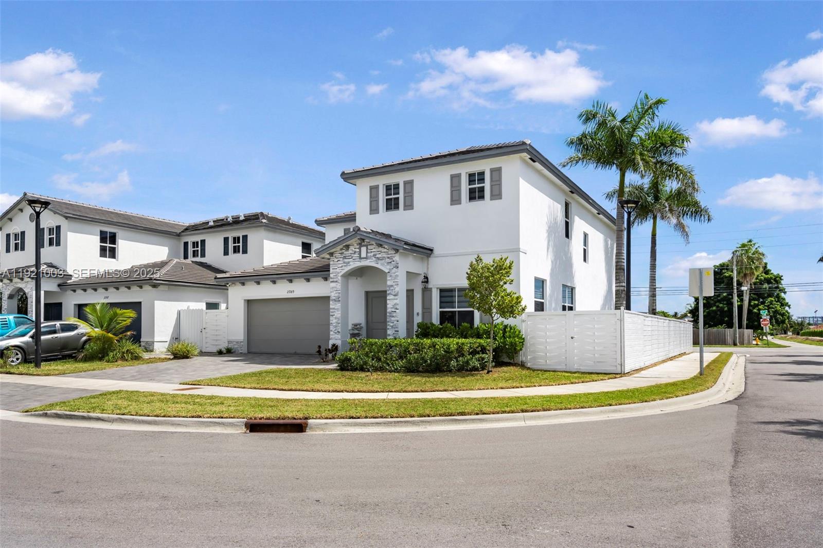 21189 Southwest 127th Court Miami, FL 33177 - Photo 3 of 46 a front view of a house with swimming pool and porch