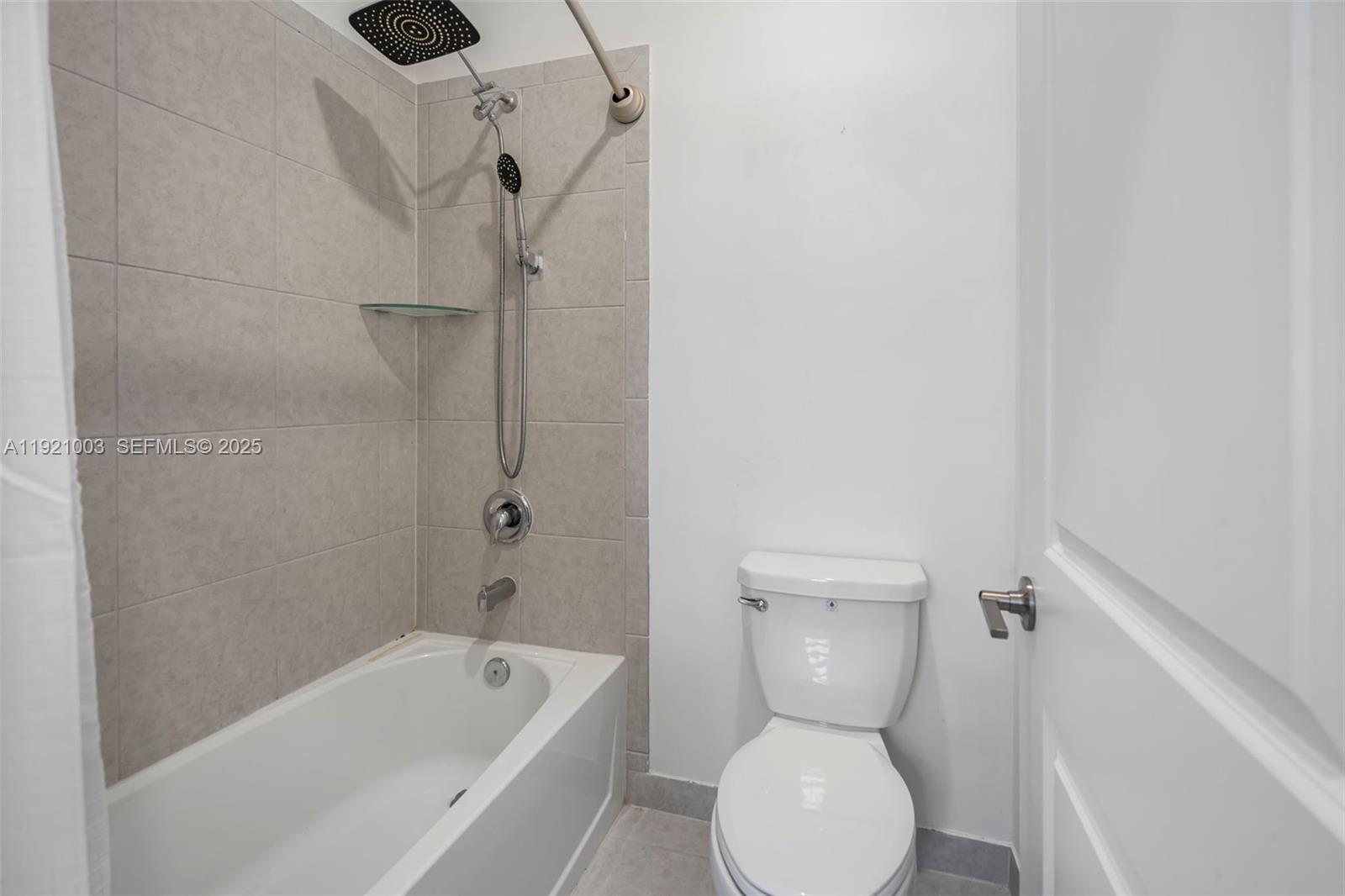 21189 Southwest 127th Court Miami, FL 33177 - Photo 31 of 46 a bathroom with a toilet sink and shower