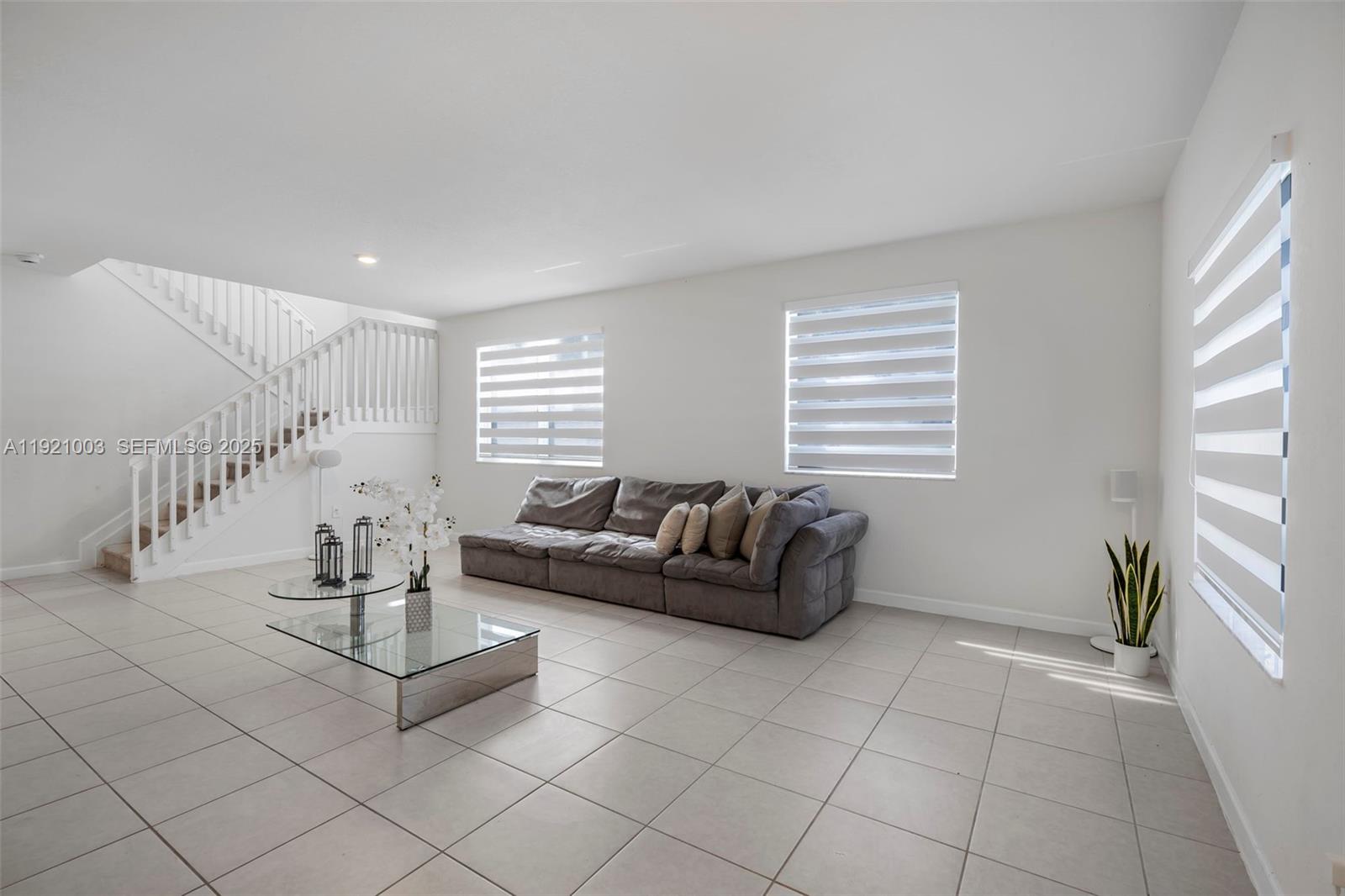 21189 Southwest 127th Court Miami, FL 33177 - Photo 4 of 46 a living room with furniture and wooden floor