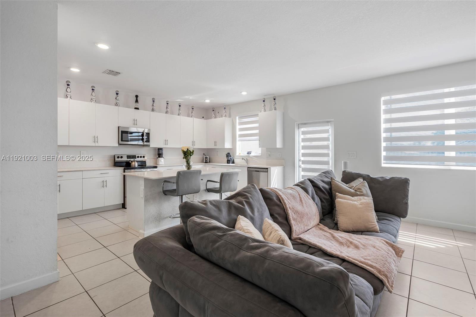 21189 Southwest 127th Court Miami, FL 33177 - Photo 6 of 46 a bedroom with furniture and a large window