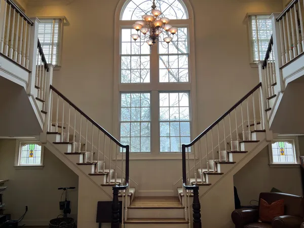 a view of entryway and hall with wooden floor