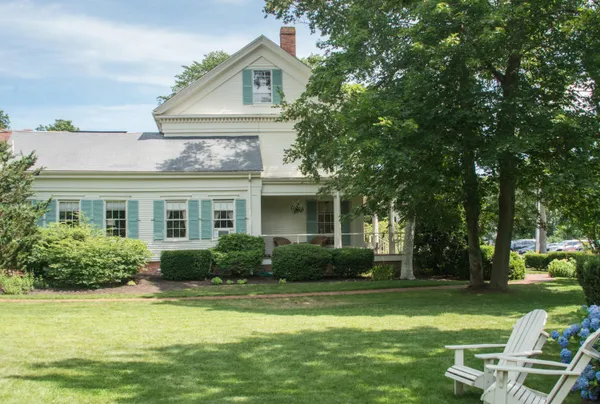 a front view of house with yard and green space