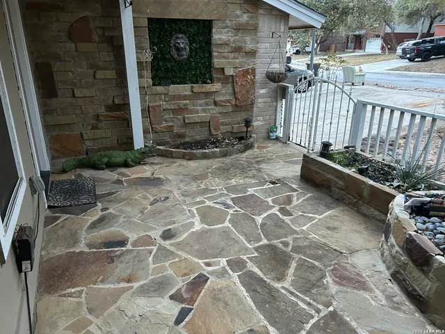 a view of a door with a bench