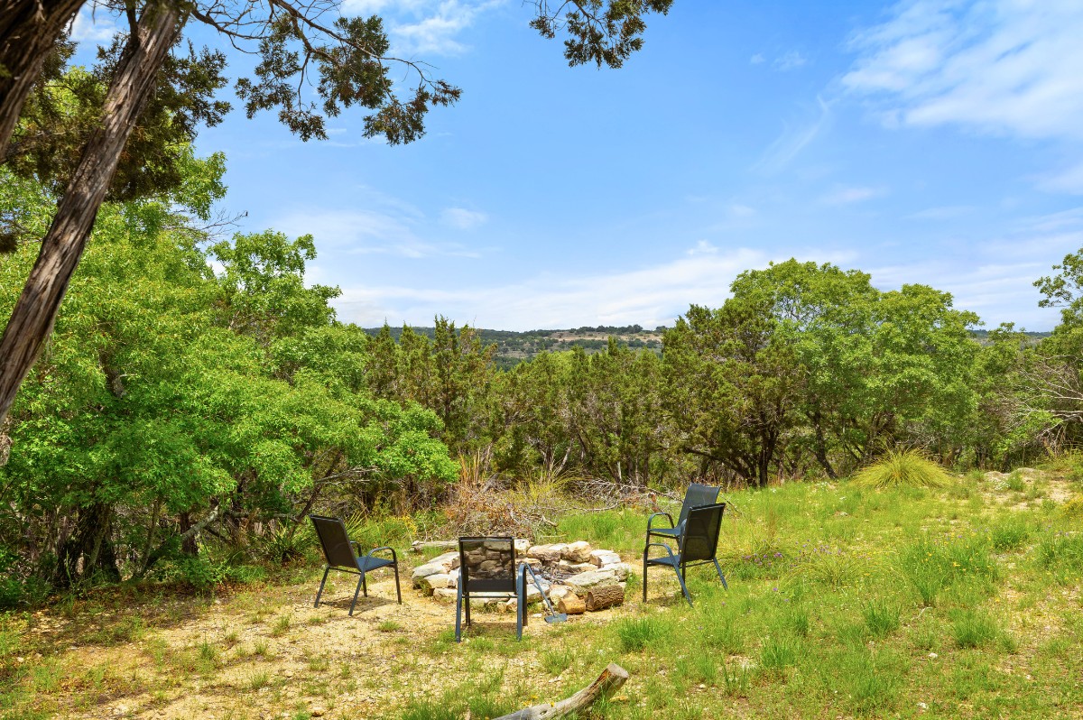 17 September Ridge Johnson City, TX 78636 - Photo 31 of 40 View of yard with a fire pit and a view of trees