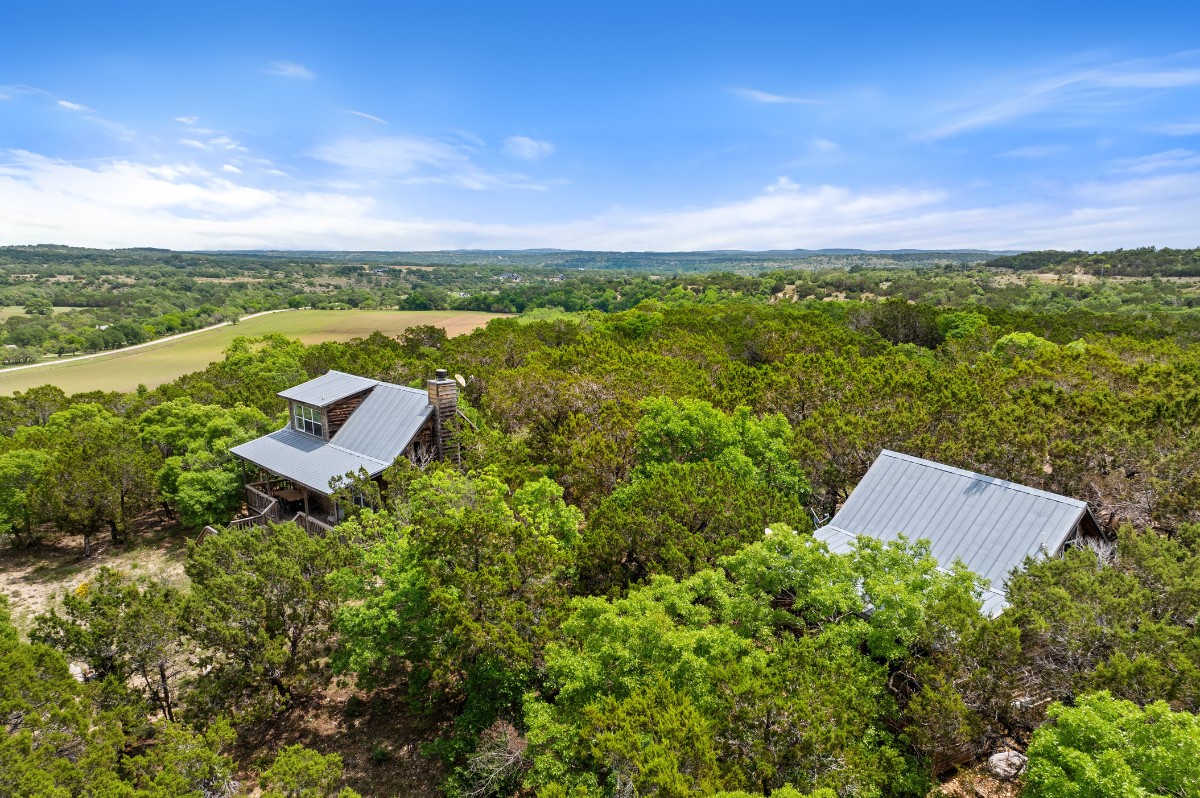 17 September Ridge Johnson City, TX 78636 - Photo 37 of 40 Aerial view of property and surrounding area featuring a forest