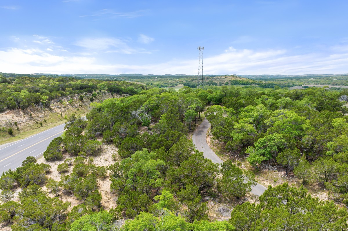 17 September Ridge Johnson City, TX 78636 - Photo 40 of 40 Aerial view of property and surrounding area with a forest