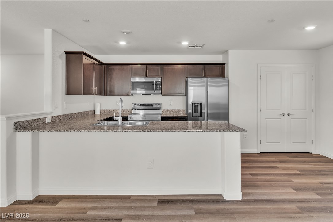 6952 Crescent Gold Street North Las Vegas, NV 89086 - Photo 12 of 58 Kitchen with appliances with stainless steel finis