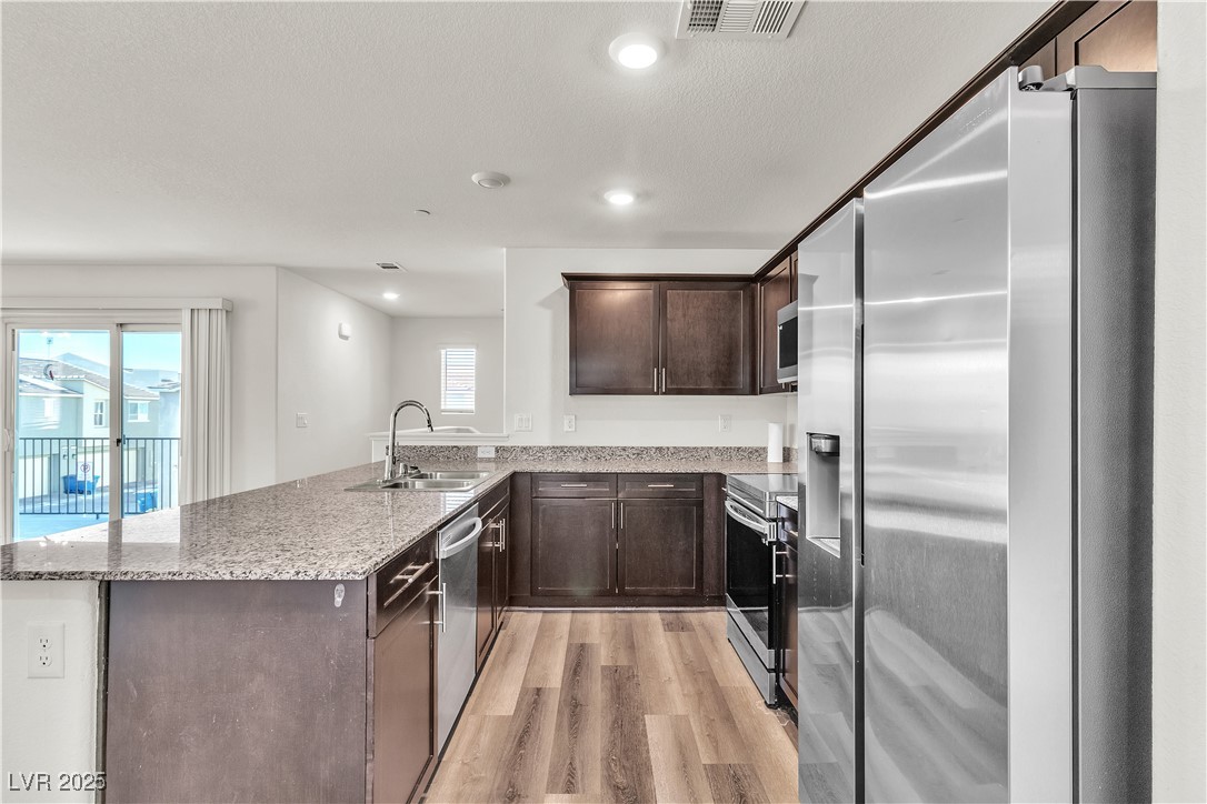 6952 Crescent Gold Street North Las Vegas, NV 89086 - Photo 16 of 58 Kitchen with appliances with stainless steel finis