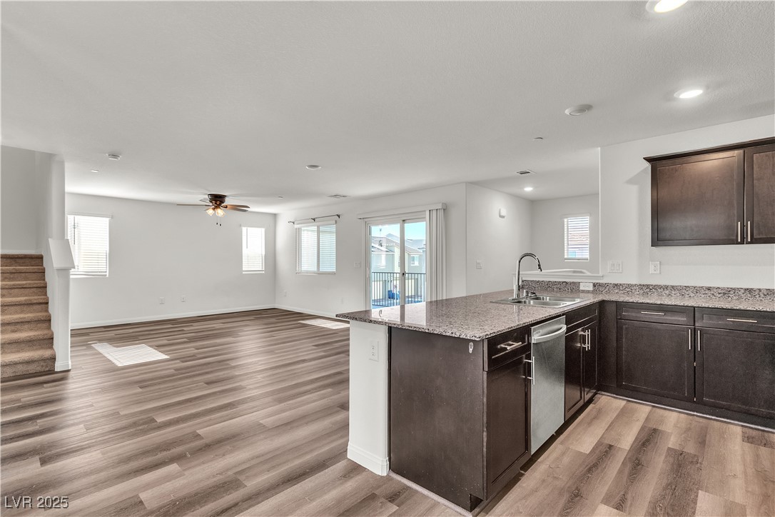 6952 Crescent Gold Street North Las Vegas, NV 89086 - Photo 17 of 58 Kitchen featuring a sink, dishwasher, open floor p