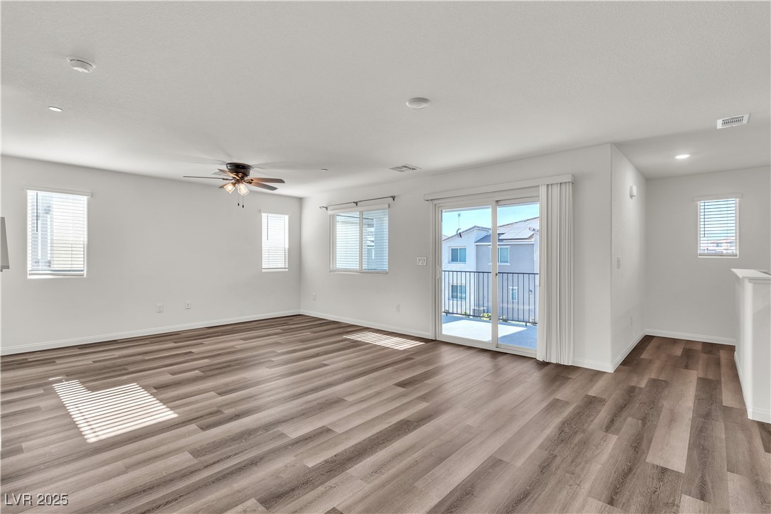 6952 Crescent Gold Street North Las Vegas, NV 89086 - Photo 18 of 58 Unfurnished room featuring healthy amount of natur