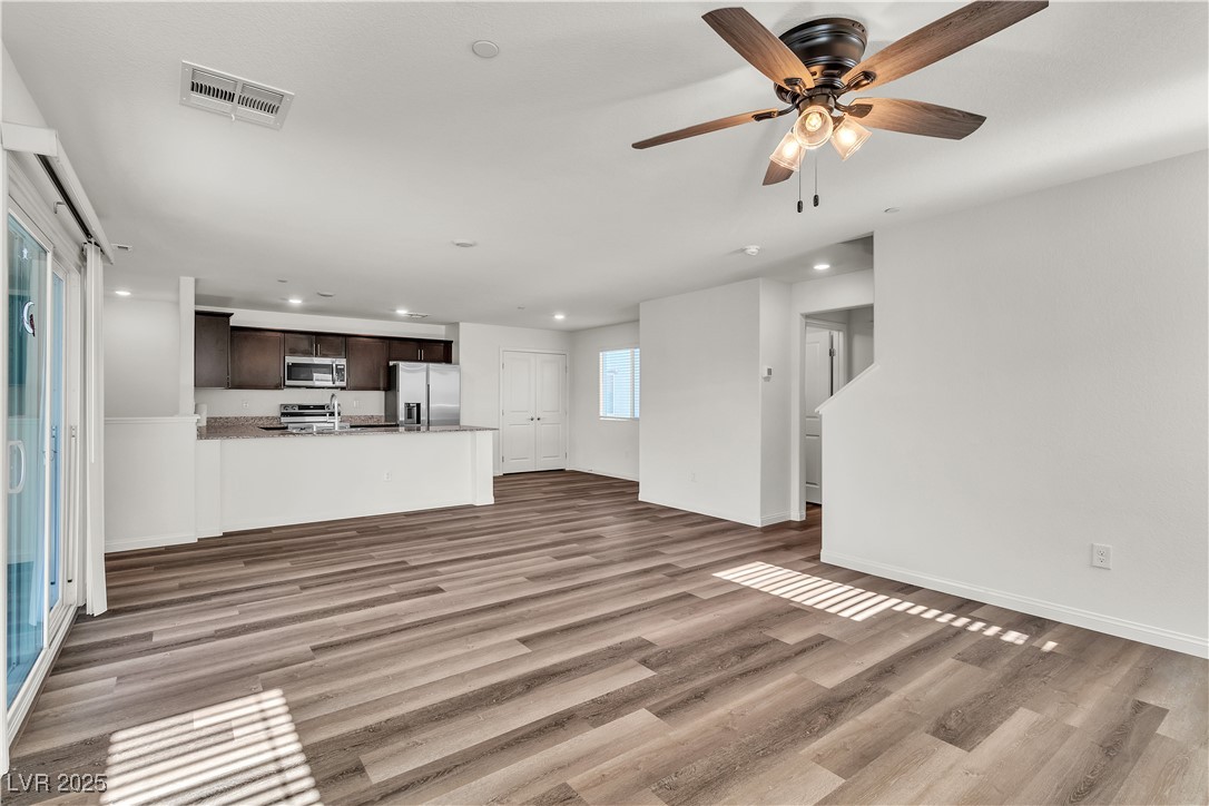 6952 Crescent Gold Street North Las Vegas, NV 89086 - Photo 23 of 58 Unfurnished living room with recessed lighting, wo
