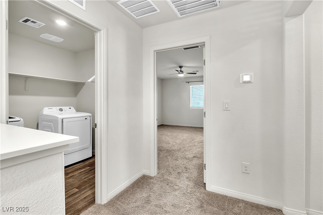 6952 Crescent Gold Street North Las Vegas, NV 89086 - Photo 27 of 58 Washroom featuring light carpet, washer and clothe