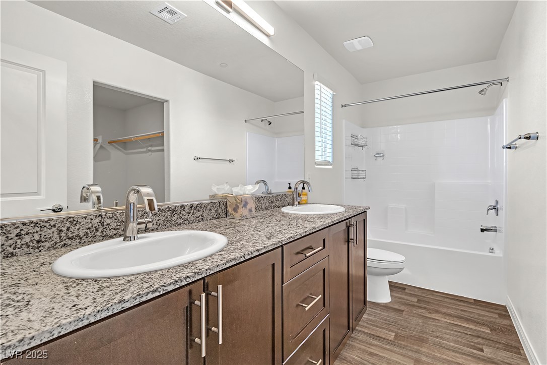 6952 Crescent Gold Street North Las Vegas, NV 89086 - Photo 31 of 58 Bathroom with wood finished floors, double vanity,