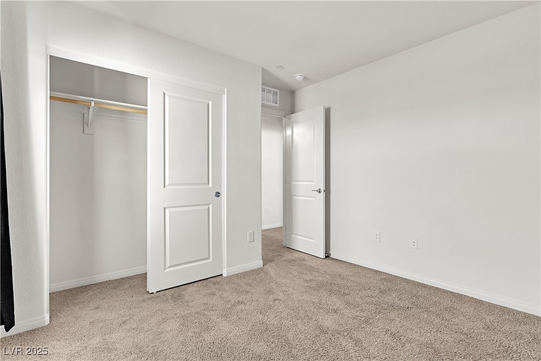 6952 Crescent Gold Street North Las Vegas, NV 89086 - Photo 36 of 58 Unfurnished bedroom with carpet flooring, baseboar