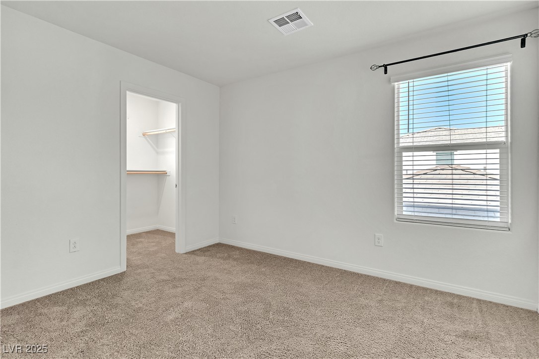 6952 Crescent Gold Street North Las Vegas, NV 89086 - Photo 37 of 58 Unfurnished room with light colored carpet and bas