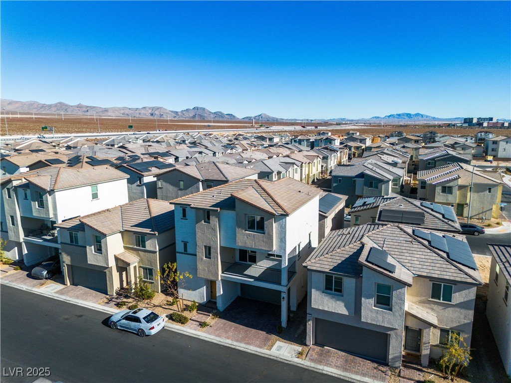 6952 Crescent Gold Street North Las Vegas, NV 89086 - Photo 40 of 58 Aerial perspective of suburban area with a mountai