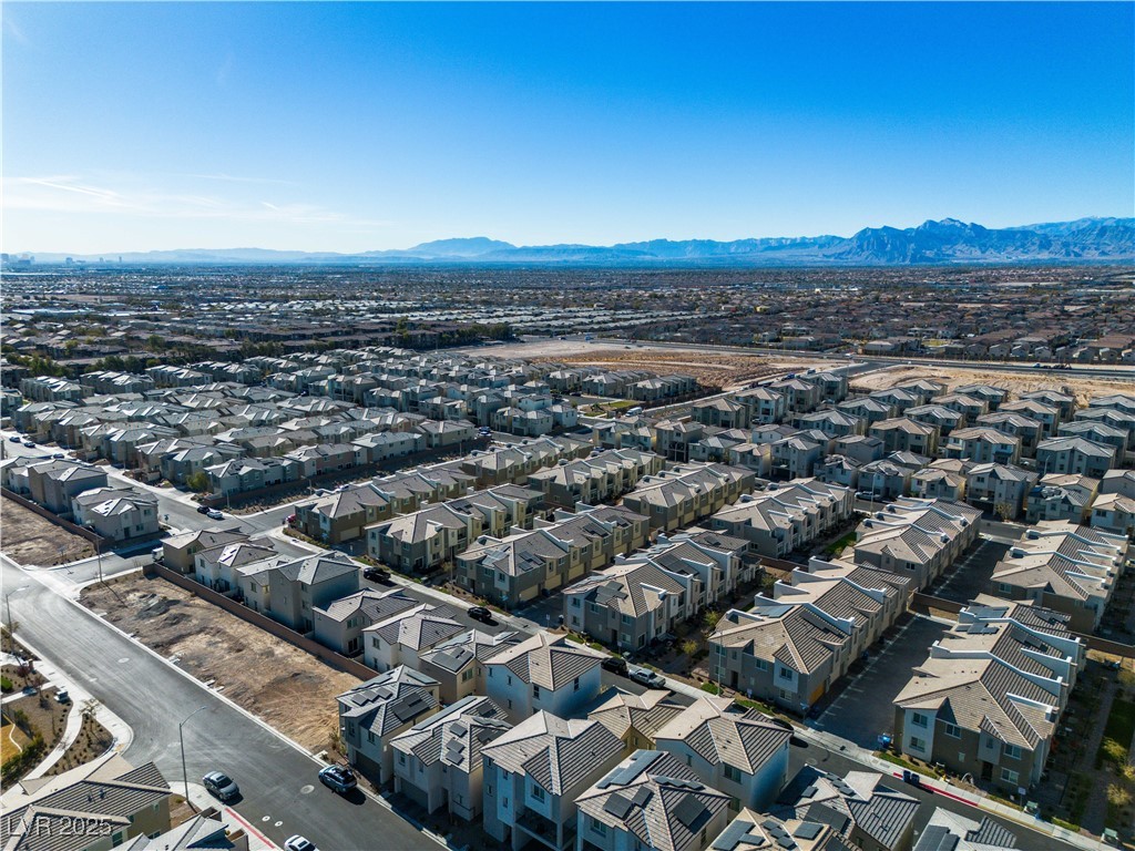 6952 Crescent Gold Street North Las Vegas, NV 89086 - Photo 47 of 58 Aerial perspective of suburban area featuring a mo