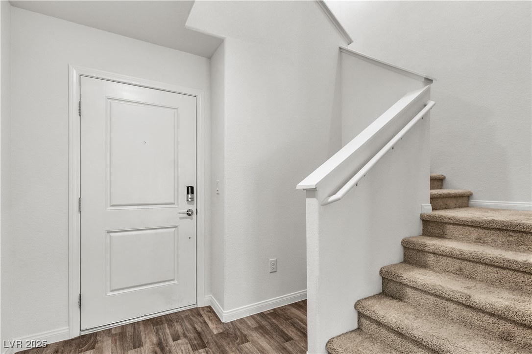 6952 Crescent Gold Street North Las Vegas, NV 89086 - Photo 7 of 58 Entryway featuring dark wood finished floors, stai