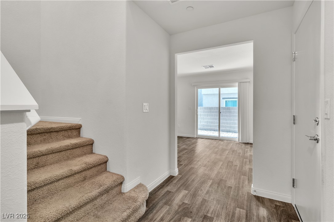 6952 Crescent Gold Street North Las Vegas, NV 89086 - Photo 8 of 58 Stairs featuring wood finished floors and baseboar