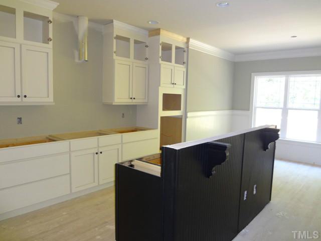 6029 Jeffreys Grove School Road Raleigh, NC 27612 - Photo 3 of 15 a kitchen with stainless steel appliances granite countertop a refrigerator a sink dishwasher with wooden cabinets and floor