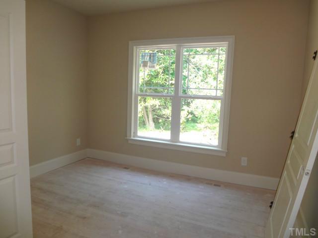 6029 Jeffreys Grove School Road Raleigh, NC 27612 - Photo 9 of 15 an empty room with a window