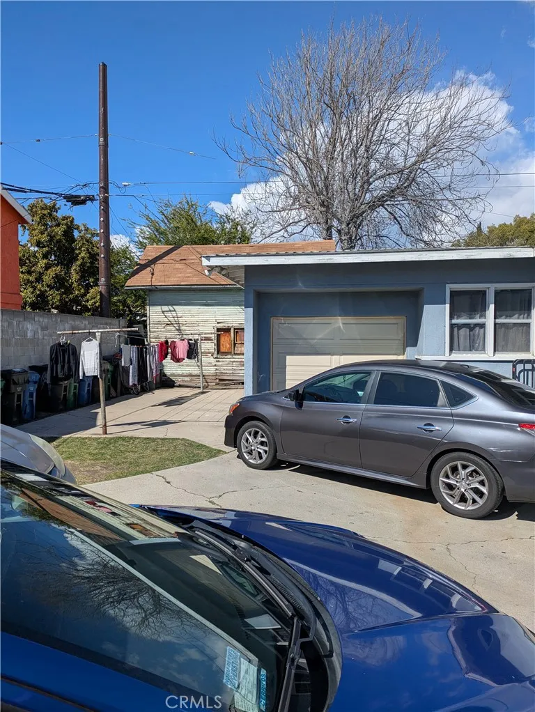 6809 Heliotrope Avenue Bell, CA 90201 - Photo 12 of 18 a car parked in front of a house